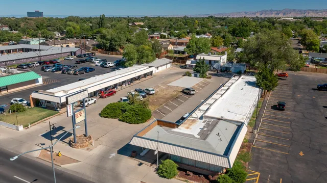 an aerial view of a swimming pool with patio