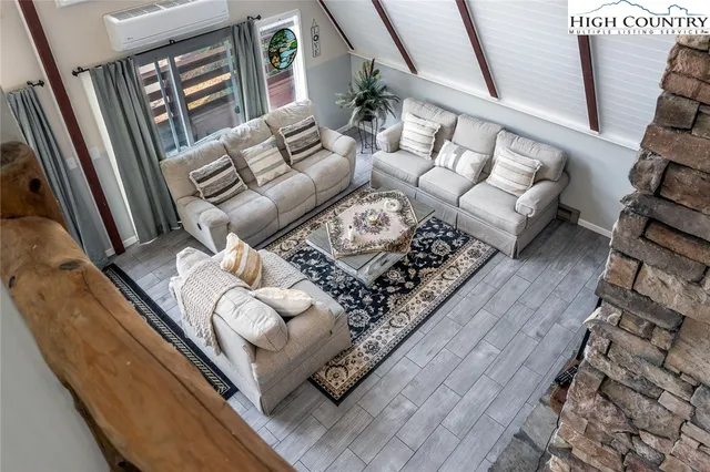 a living room with furniture and a rug