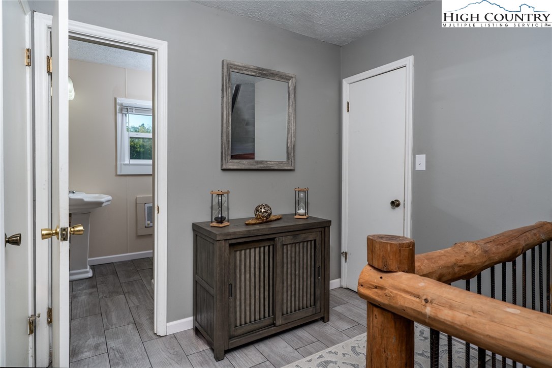 209 Apache Street Newland, NC 28657 - Photo 21 of 42 a view of a hallway with workspace and a window