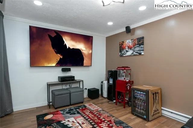 a bedroom with furniture and a lamp