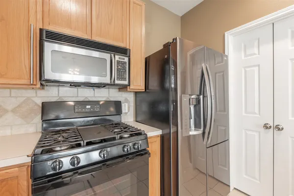 a kitchen with a stove and a microwave