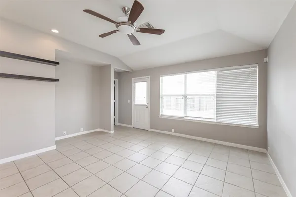 a view of an empty room with a window