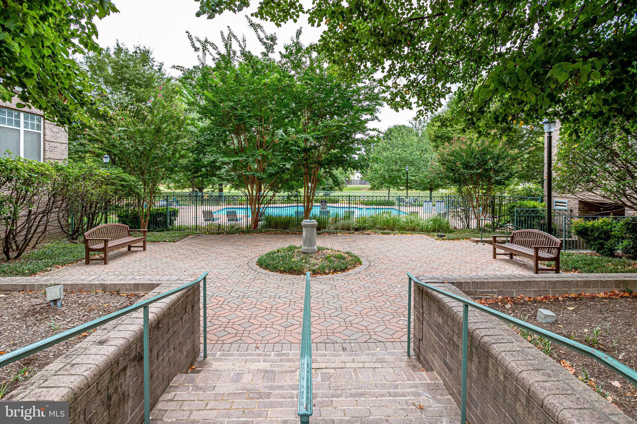 5565 Seminary Road, Unit 307 Falls Church, VA 22041 - Photo 14 of 15 a view of a patio with chairs and a table
