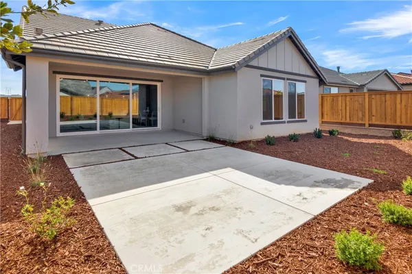 a spacious bedroom with a bed and window