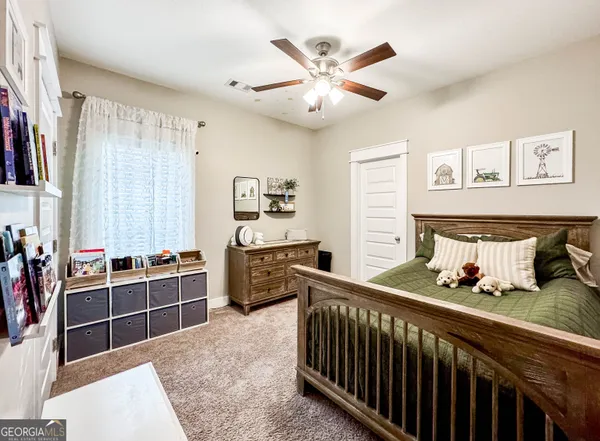 a bedroom with furniture and a window