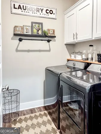 a kitchen with a stove and a refrigerator