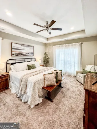 a bedroom with a bed and a couch