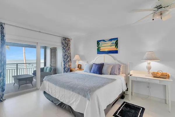 a kitchen with stainless steel appliances kitchen island granite countertop a table chairs in it and wooden floors