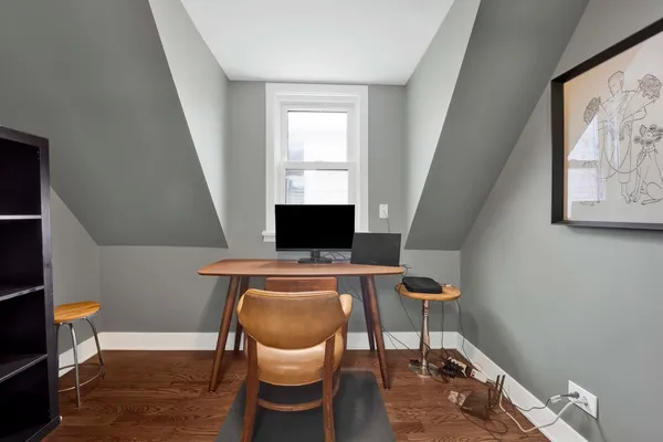 a workspace with furniture and a window