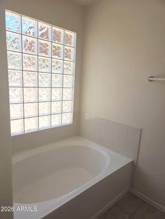 a bath tub sitting next to a window