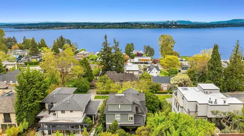 an aerial view of a house with a lake view