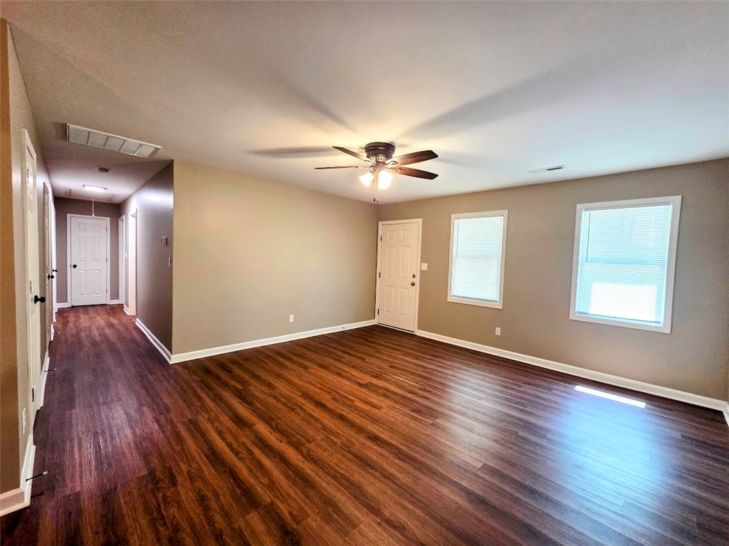 509 Elrod Road Piedmont, SC 29673 - Photo 15 of 28 Hardwood flooring extends throughout this generous living area, offering a clean, adaptable space.