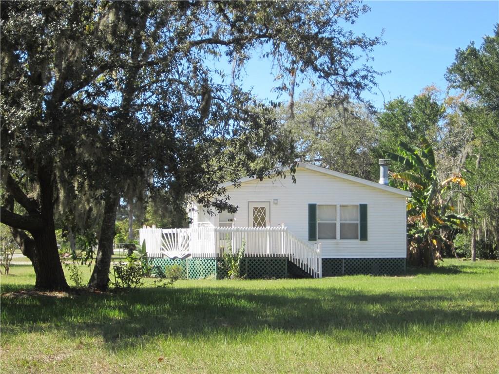 9807 Ray Street Hudson, FL 34669 - Photo 1 of 1 New Roof - March 2016 on this 1999 Doublewide with 1512 sq ft