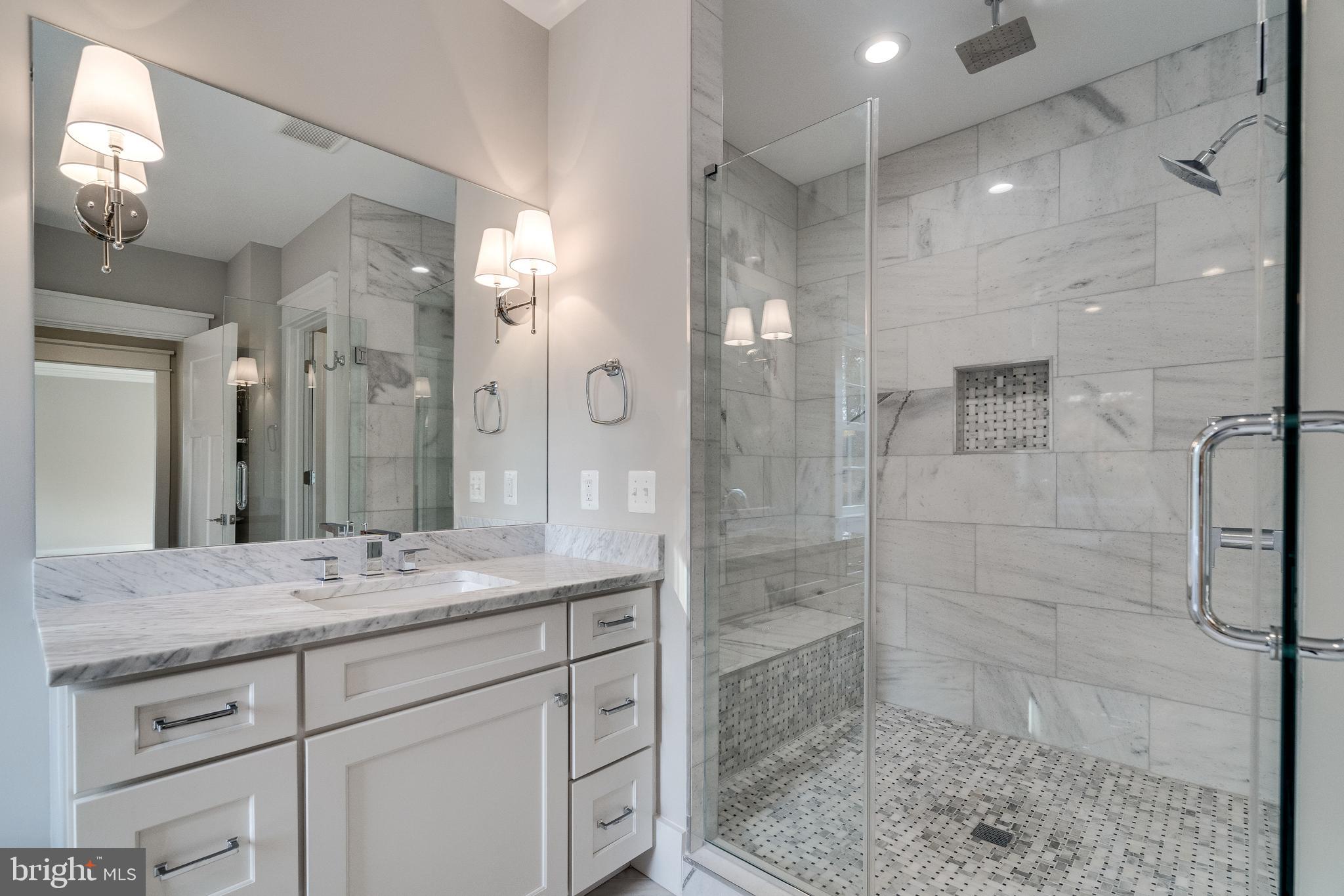 8016 Wellington Road Alexandria, VA 22308 - Photo 23 of 43 Carrara marble bath with walk-in glass shower