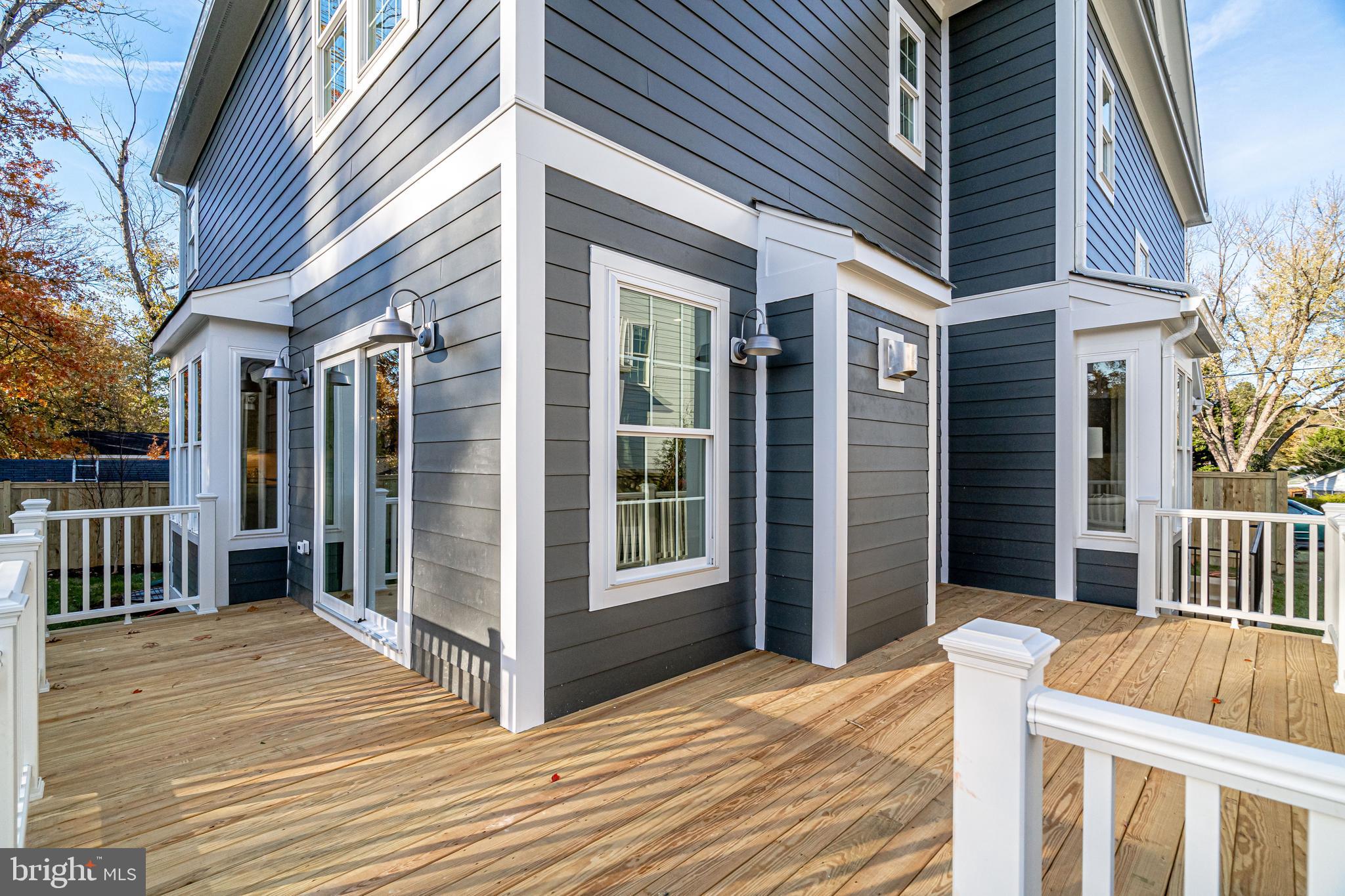 8016 Wellington Road Alexandria, VA 22308 - Photo 38 of 43 Wrap-around deck with pressure treated wood