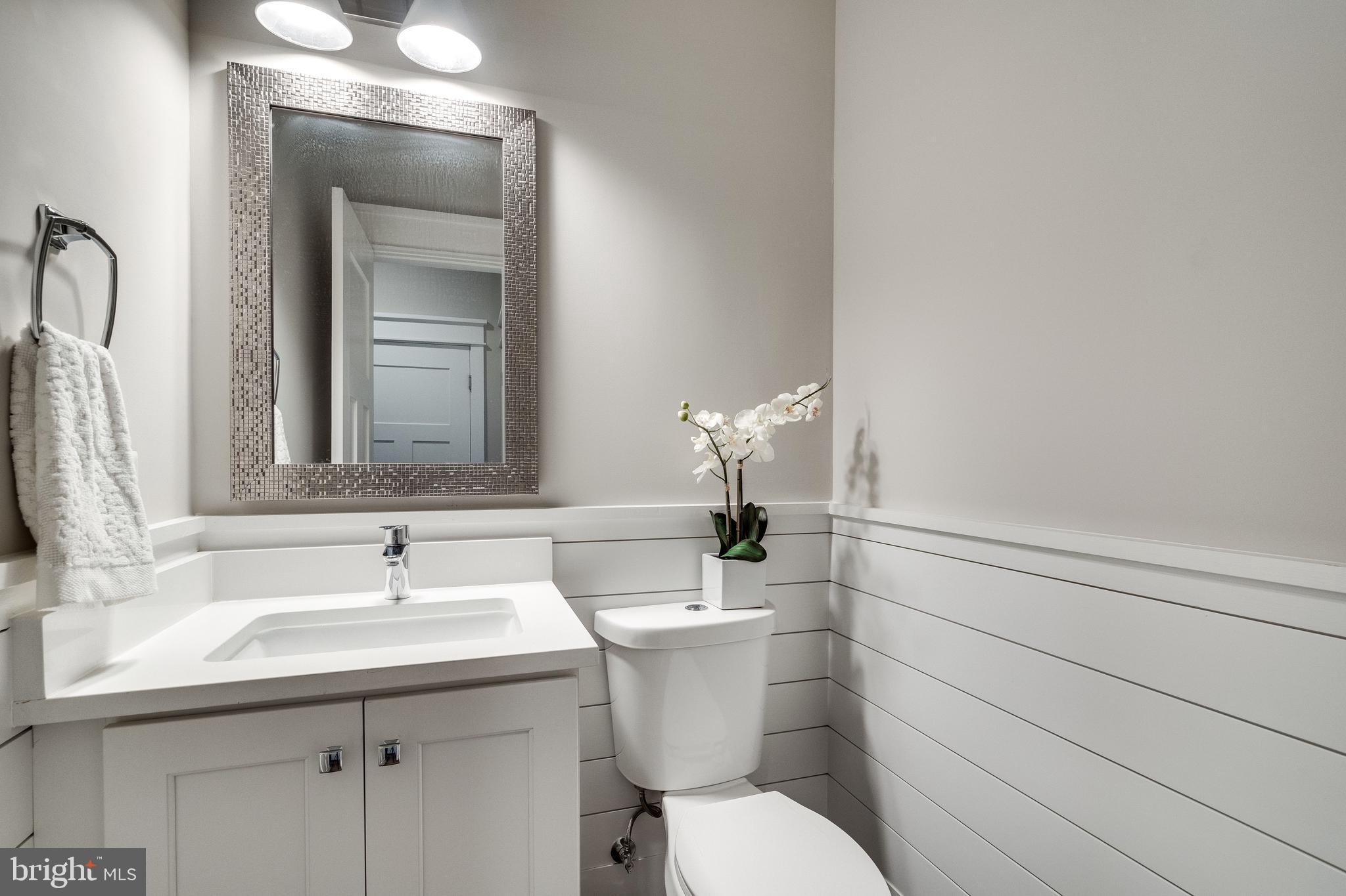 8016 Wellington Road Alexandria, VA 22308 - Photo 7 of 43 Half bath on main level with shiplap