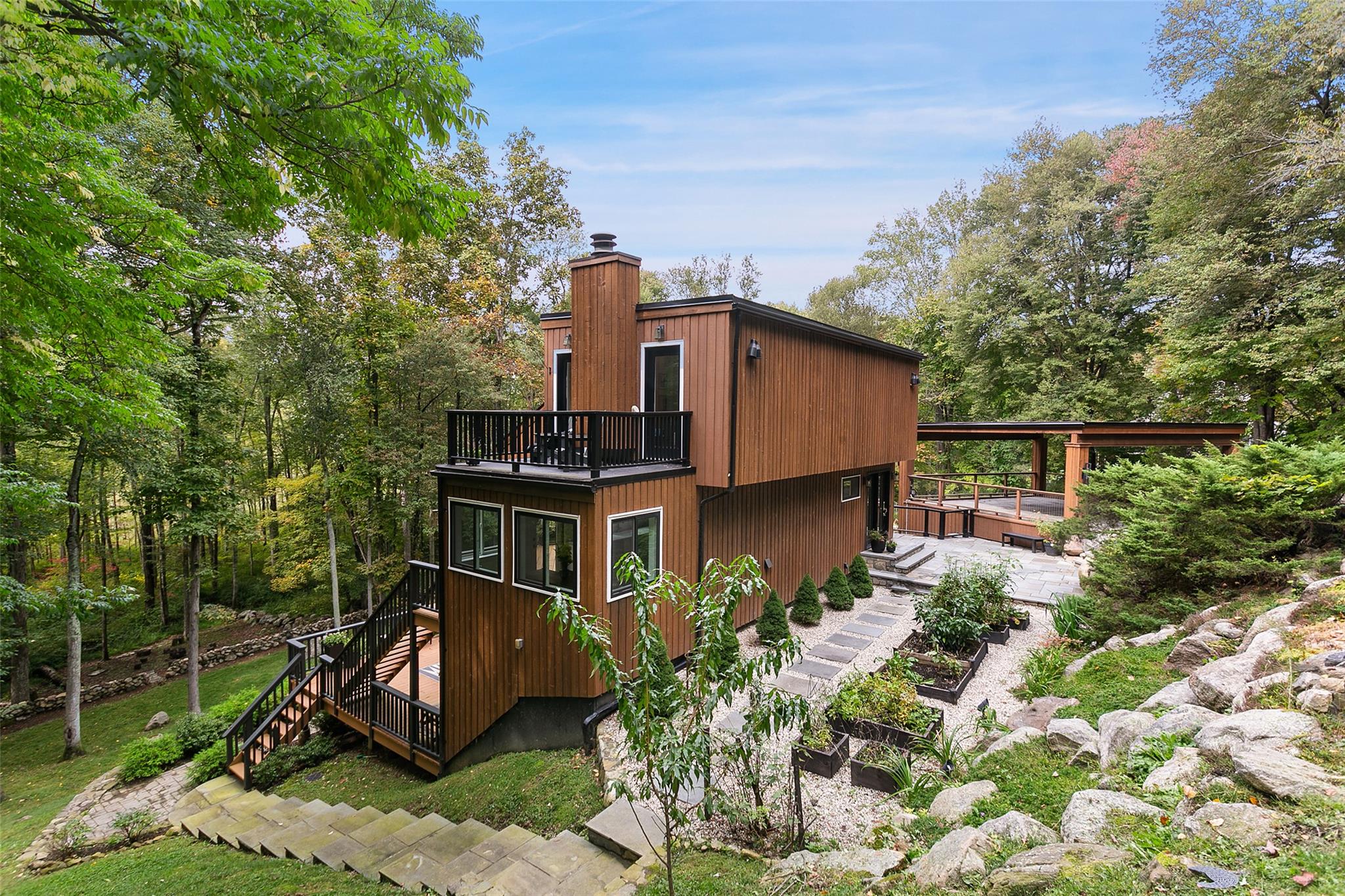 a front view of a house with garden