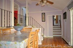 11 Shawnee Road Trumbull, CT 06611 - Photo 7 of 14 a view of a hallway with a dining table and chandelier