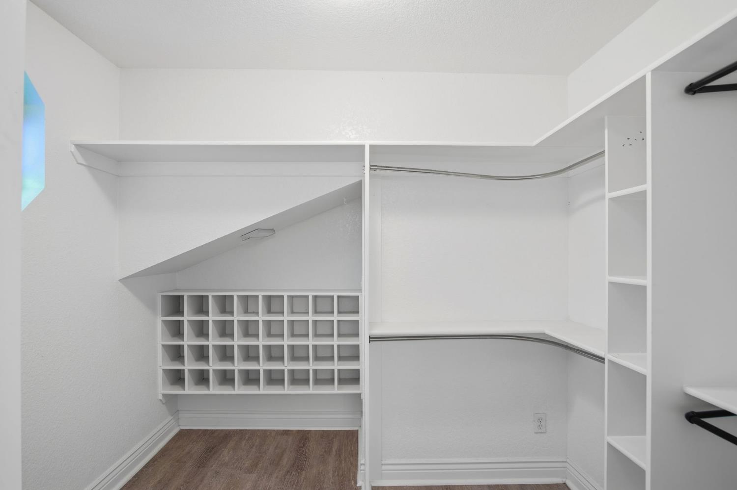 10401 Golf Link Road Turlock, CA 95380 - Photo 34 of 63 a view of an empty room with wooden floor and a window