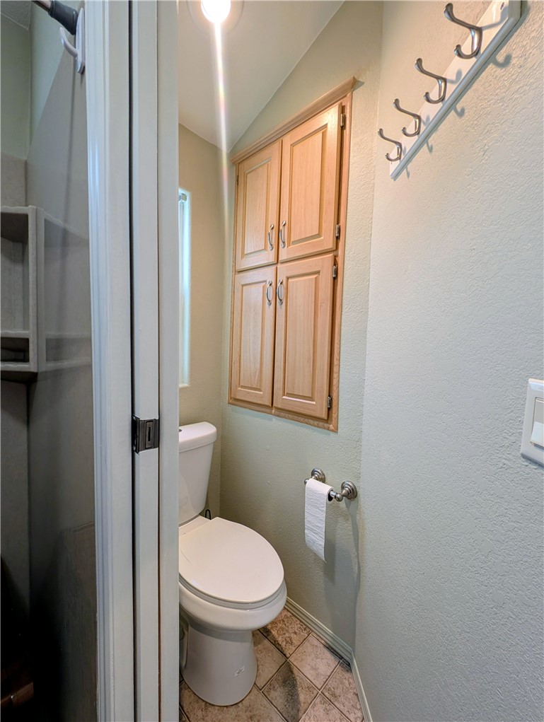 2000 Ramar Road, Unit 308 Bullhead City, AZ 86442 - Photo 20 of 27 Bathroom with light tile patterned flooring and vaulted ceiling