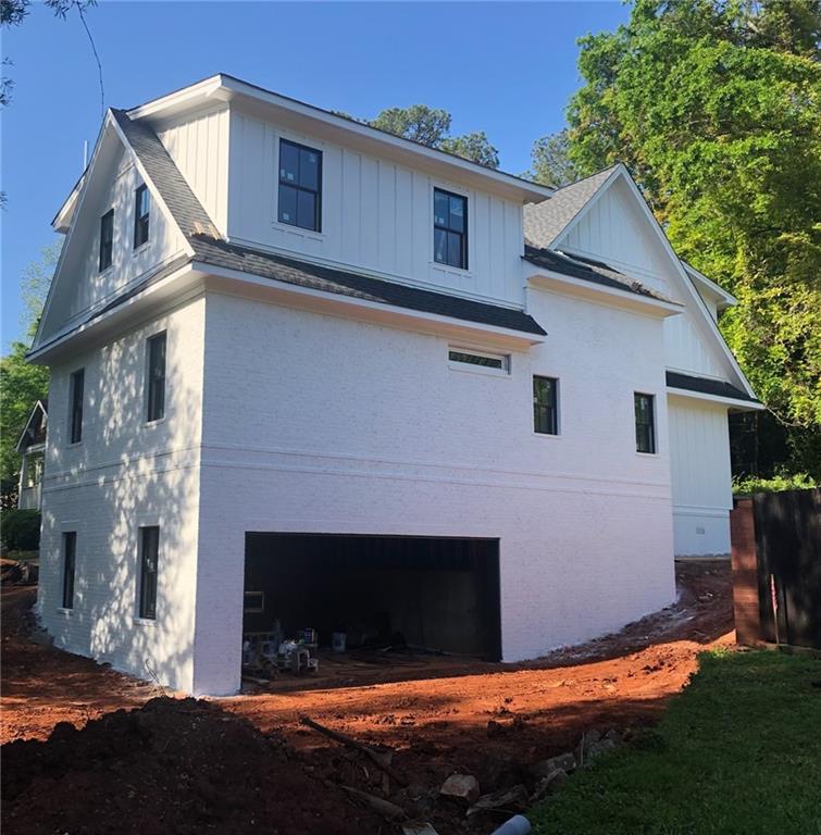 1279 Conway Road Decatur, GA 30030 - Photo 1 of 1 a house that has a big yard and a fireplace in it