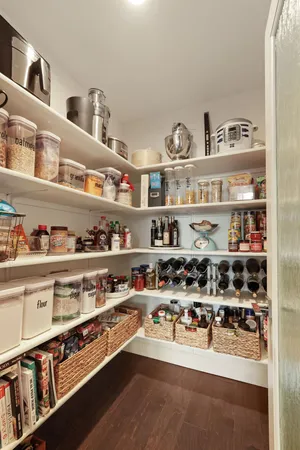 a shelf with cup and plates