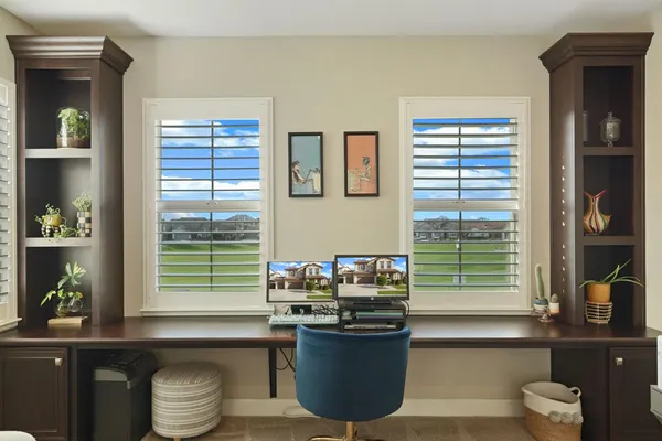 a kitchen with a window and cabinets