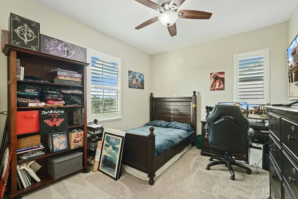 a livingroom with workspace and a window