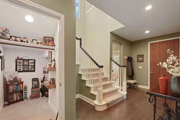 a view of entryway with workspace and stairs