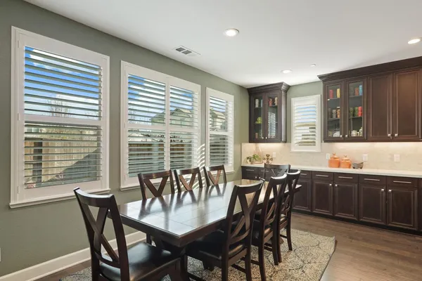 a view of a dining room and chairs and table in a room
