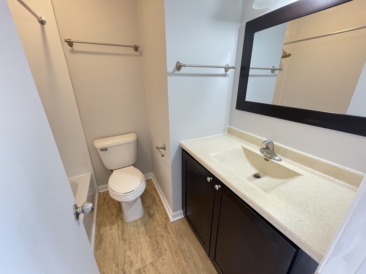 235 East Palatine Road, Unit 2B Palatine, IL 60067 - Photo 7 of 12 a bathroom with a toilet sink and mirror