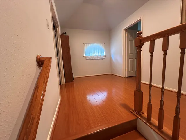 a view of a house with a yard and pathway