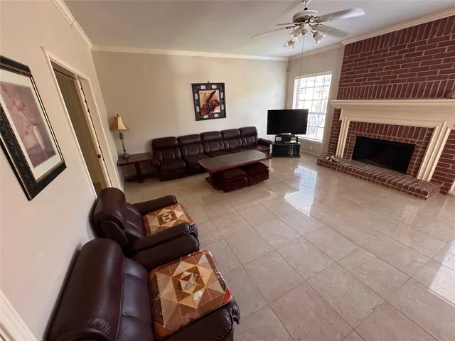 a view of a livingroom with a furniture wooden floor and chandelier