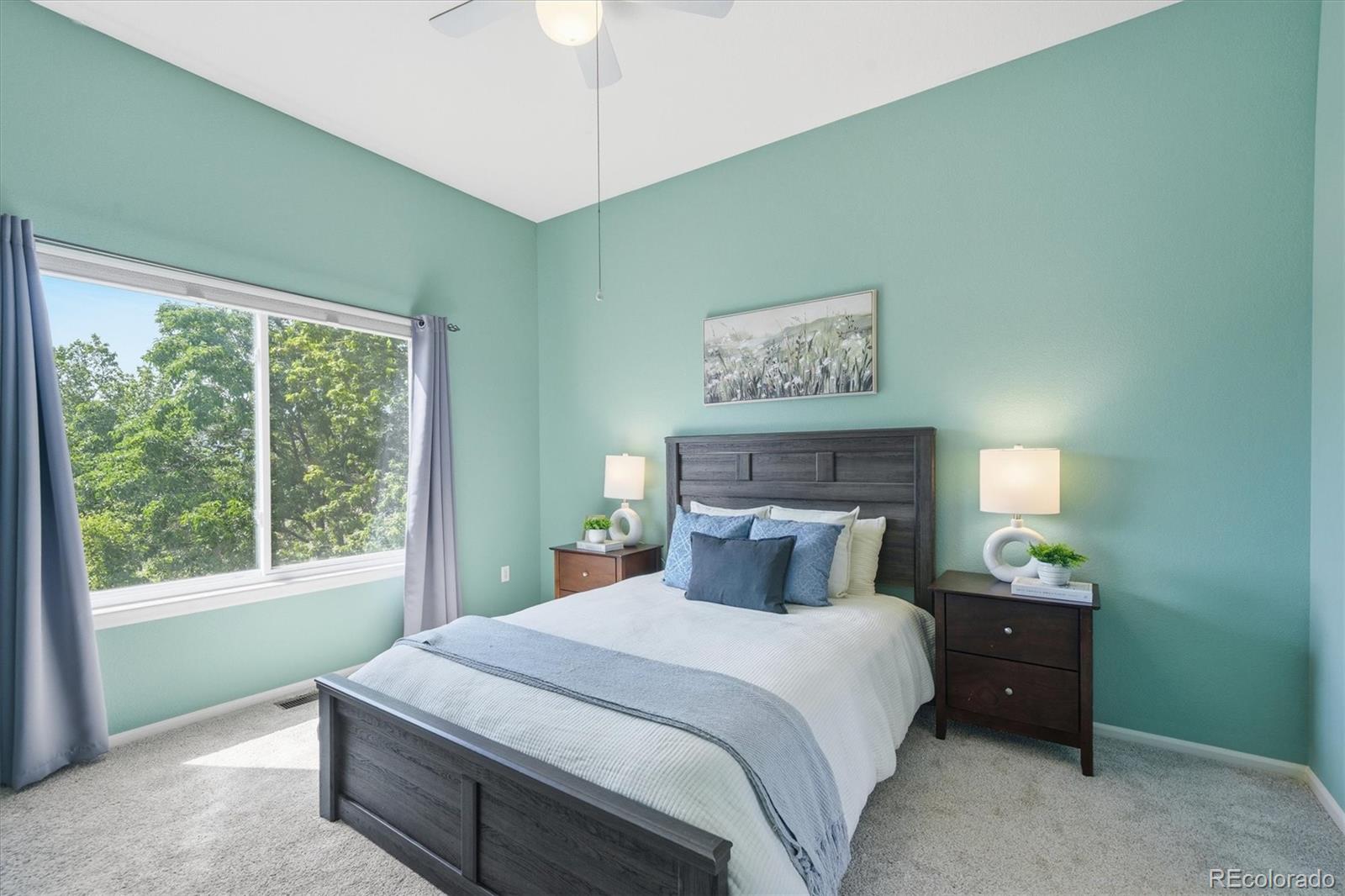 9629 Burberry Way Highlands Ranch, CO 80129 - Photo 23 of 50 a bedroom with a bed and a window