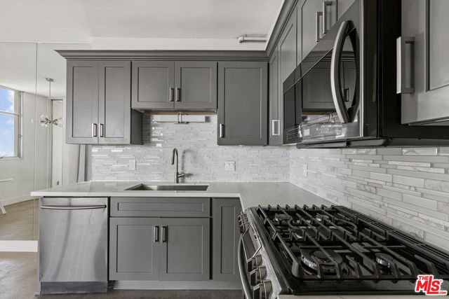 a view of room with furniture and wooden floor