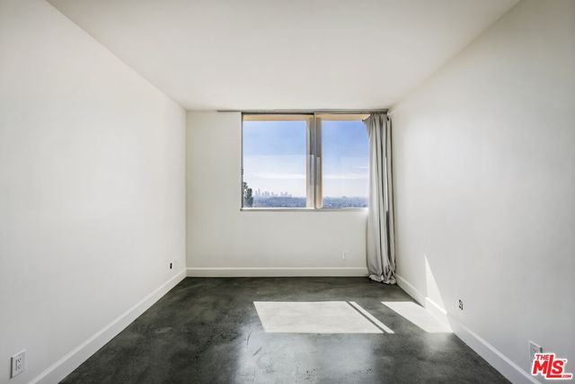 a bathroom with a sink mirror and toilet
