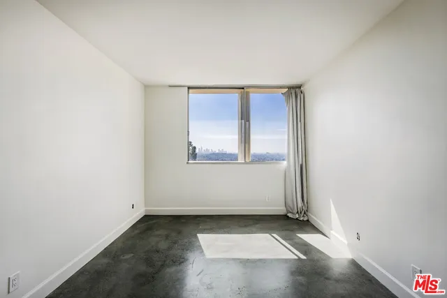a bathroom with a sink mirror and toilet
