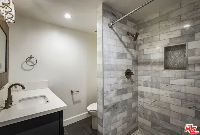 a bathroom with a sink a vanity and a mirror