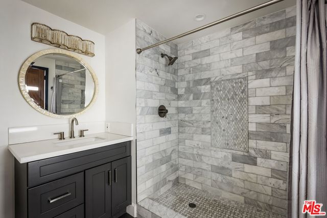 a living room with furniture a flat screen tv and a large window