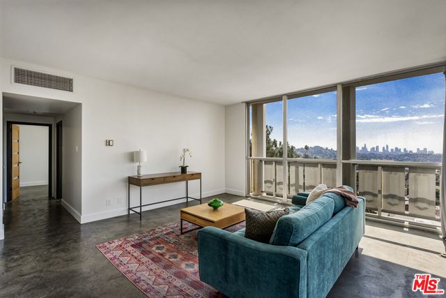a living room with couch and a table