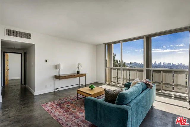 a living room with couch and a table
