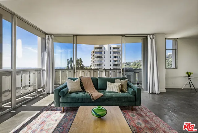 a view of a building with wooden fence