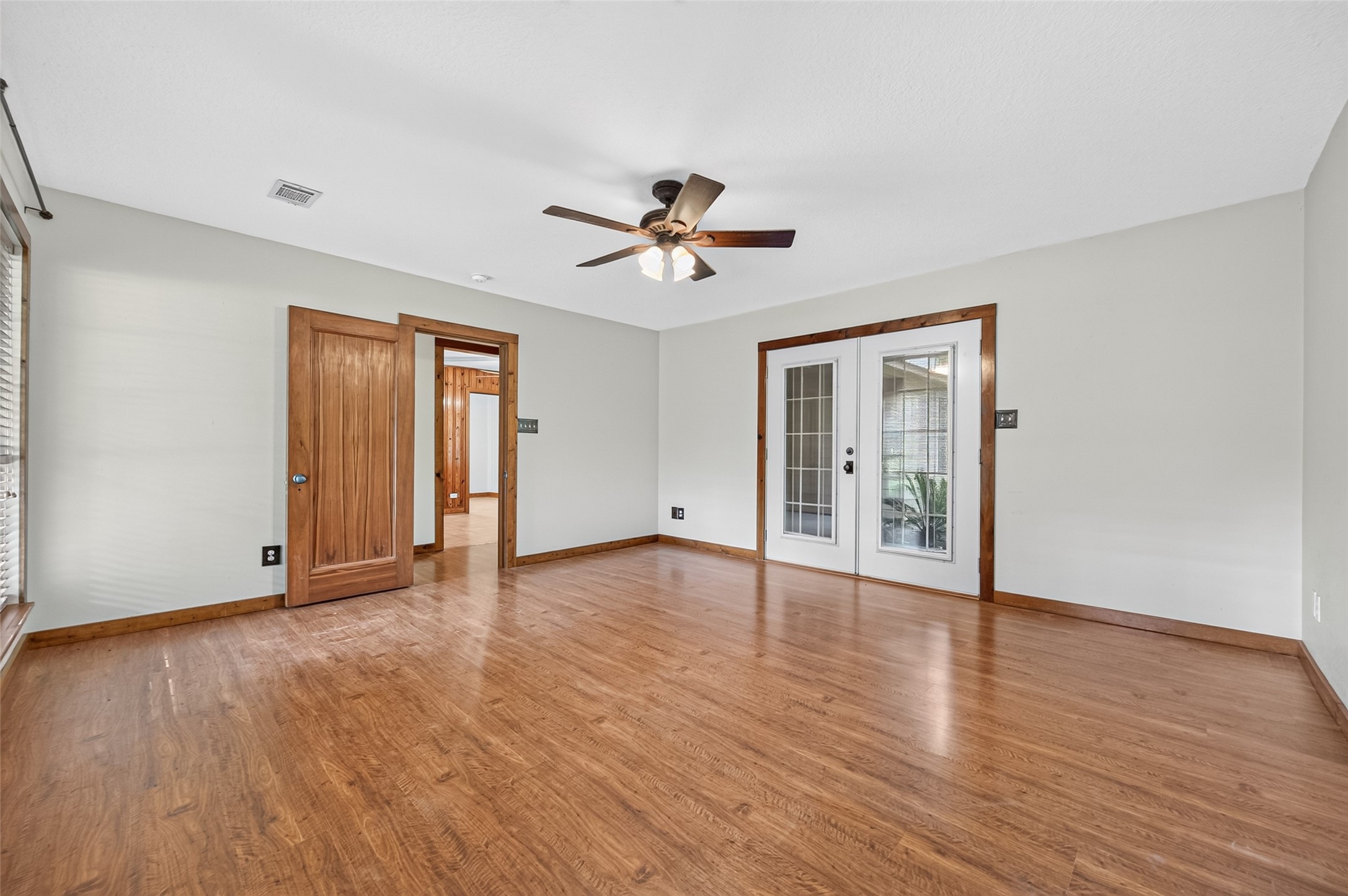 13996 Kidd Road Conroe, TX 77302 - Photo 29 of 46 Primary bedroom with French doors to patio