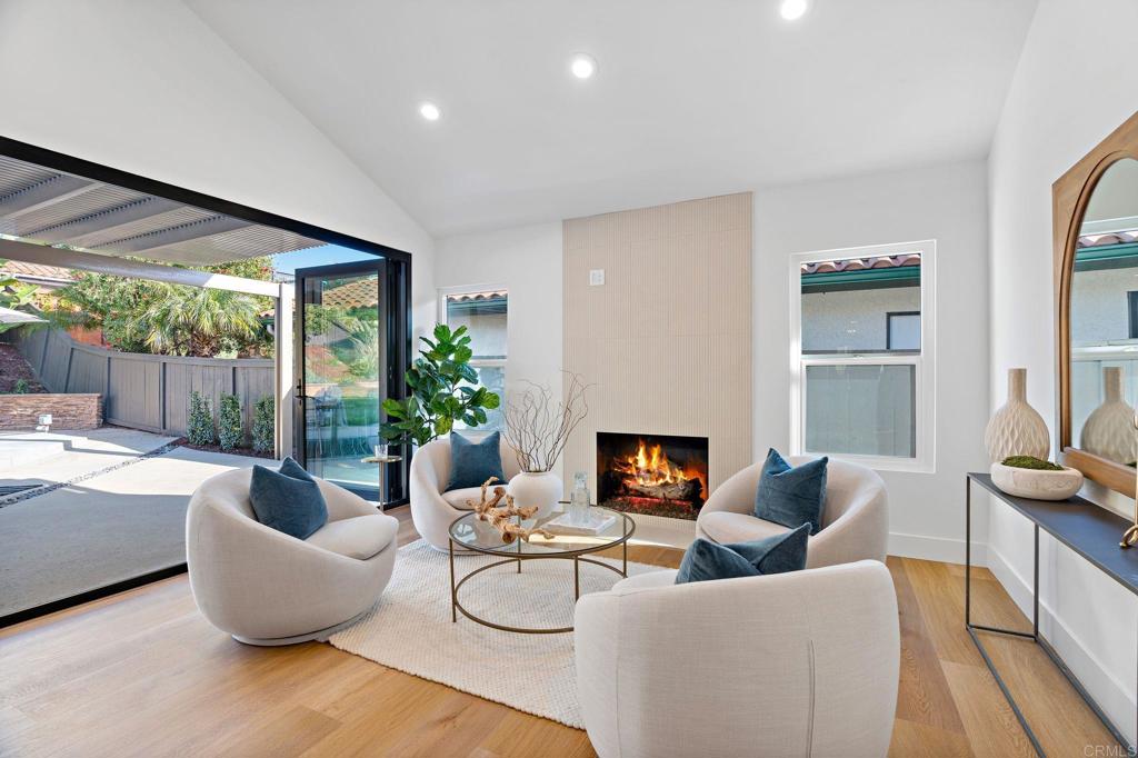 411 Gardendale Road Encinitas, CA 92024 - Photo 15 of 28 a living room with furniture and a fireplace