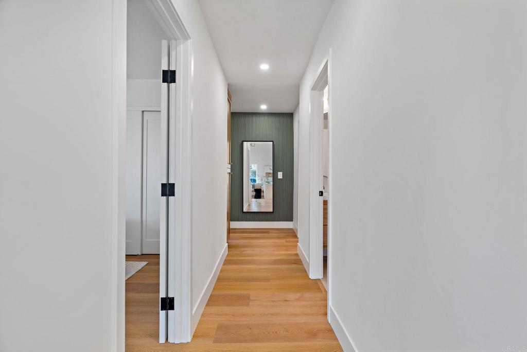 411 Gardendale Road Encinitas, CA 92024 - Photo 16 of 28 a view of a hallway with wooden floor