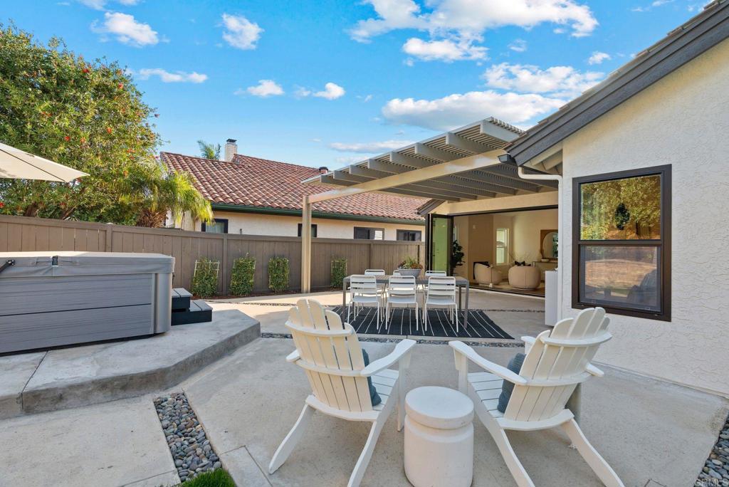 411 Gardendale Road Encinitas, CA 92024 - Photo 25 of 28 a view of a patio with table and chairs and potted plants