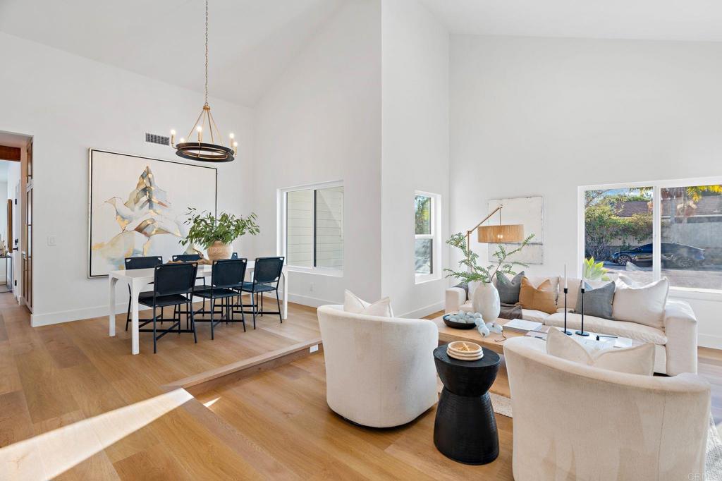 411 Gardendale Road Encinitas, CA 92024 - Photo 7 of 28 a living room with furniture and a chandelier