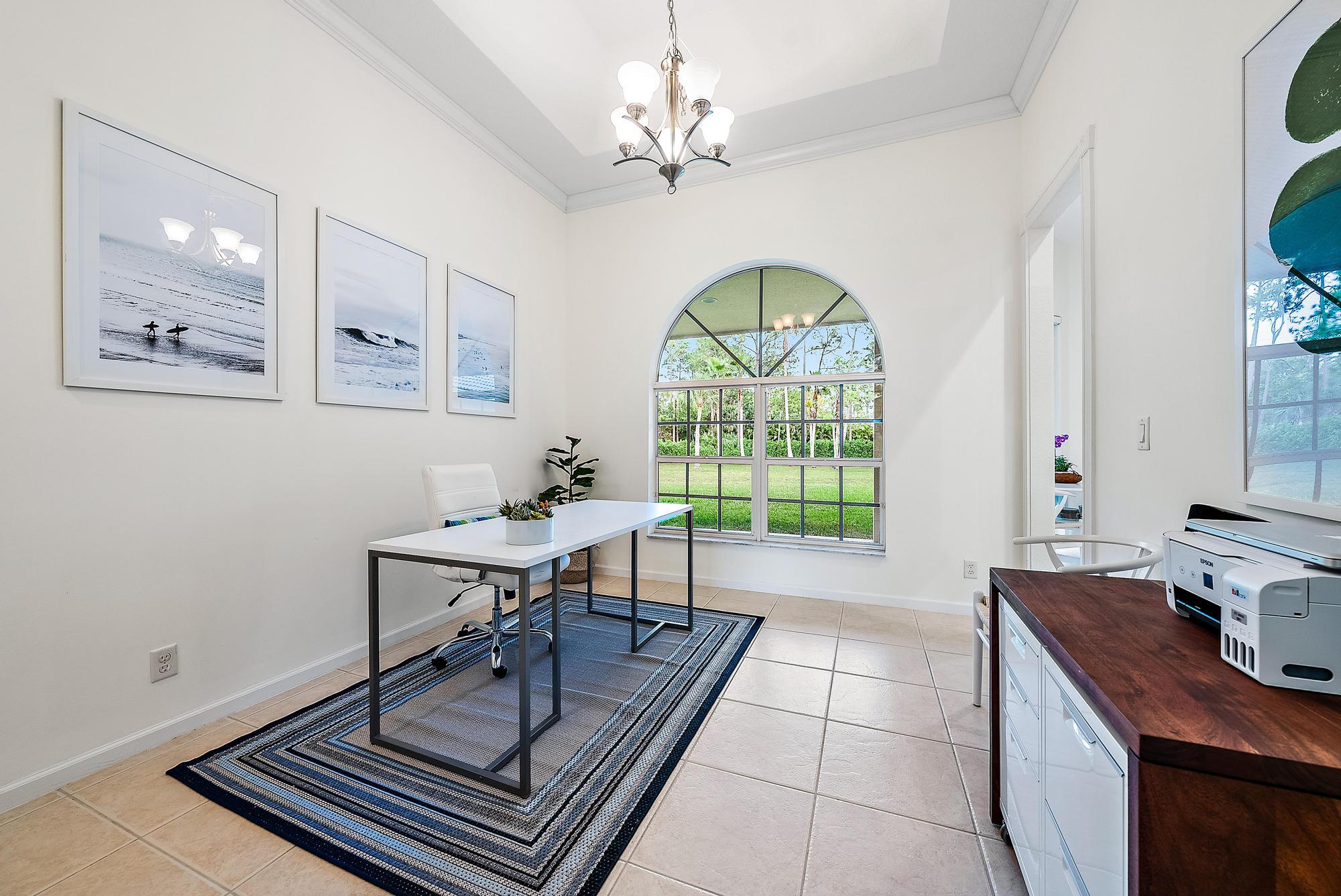 15644 Billy Goat Lane Jupiter, FL 33478 - Photo 14 of 39 a view of a livingroom with furniture and a window