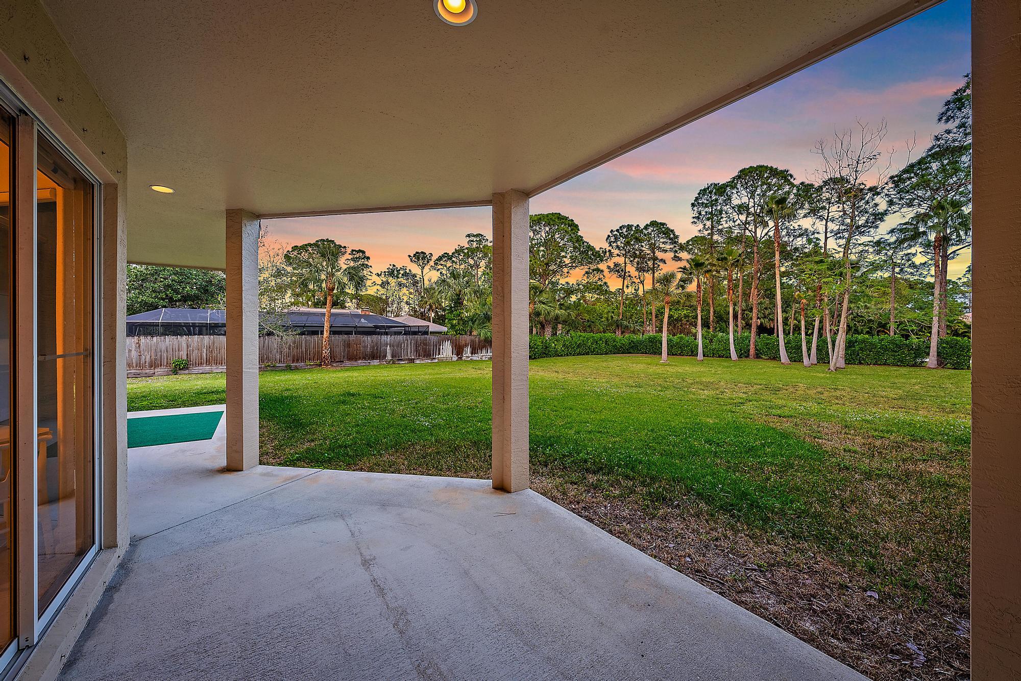 15644 Billy Goat Lane Jupiter, FL 33478 - Photo 27 of 39 a view of a house with garden