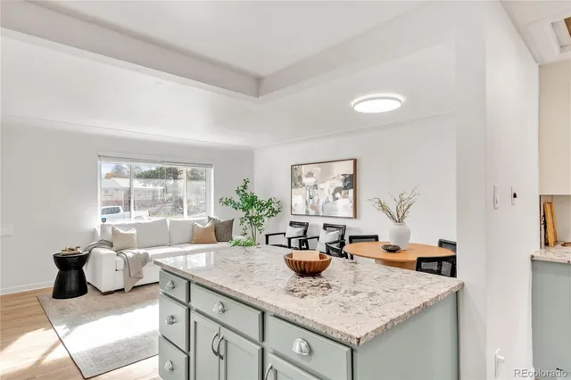a kitchen with a counter top space and furniture